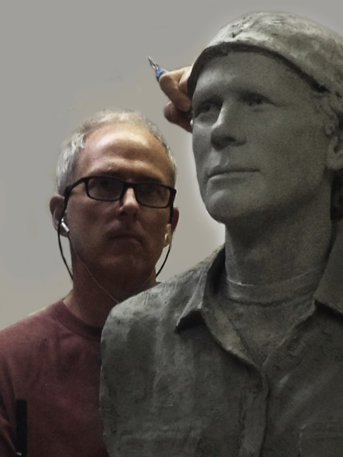 Richard Becker sculpting the clay of Ron Howard