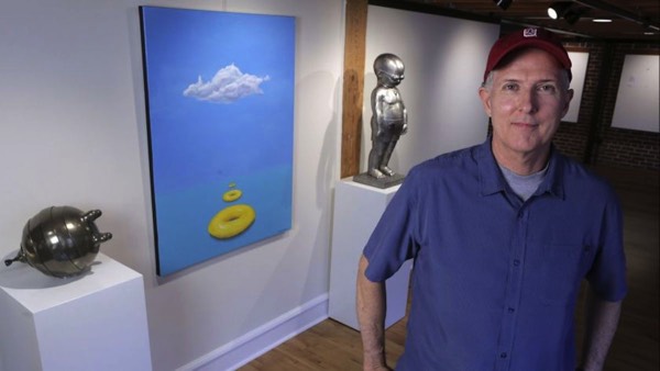 Richard Becker poses with new artworks for his solo show Float at Sparks Gallery