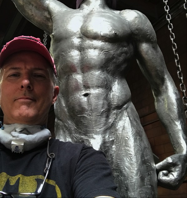 Richard Becker polishing stainless steel sculpture commission of Mercury for Los Angeles Athletic Club