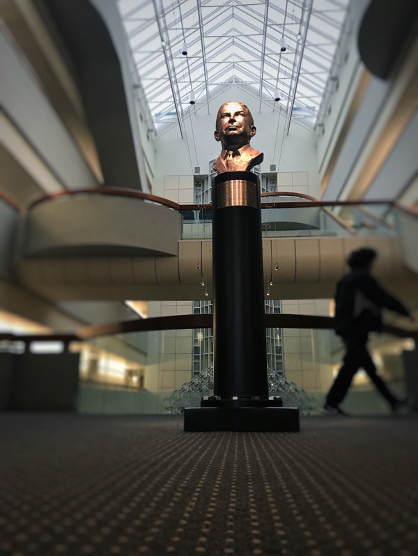 Sculpture bust of Sam Skaggs philanthropist installed at Scripps Research Institute. Stainless steel bust on black post and granite. Celebrating 20 years. 