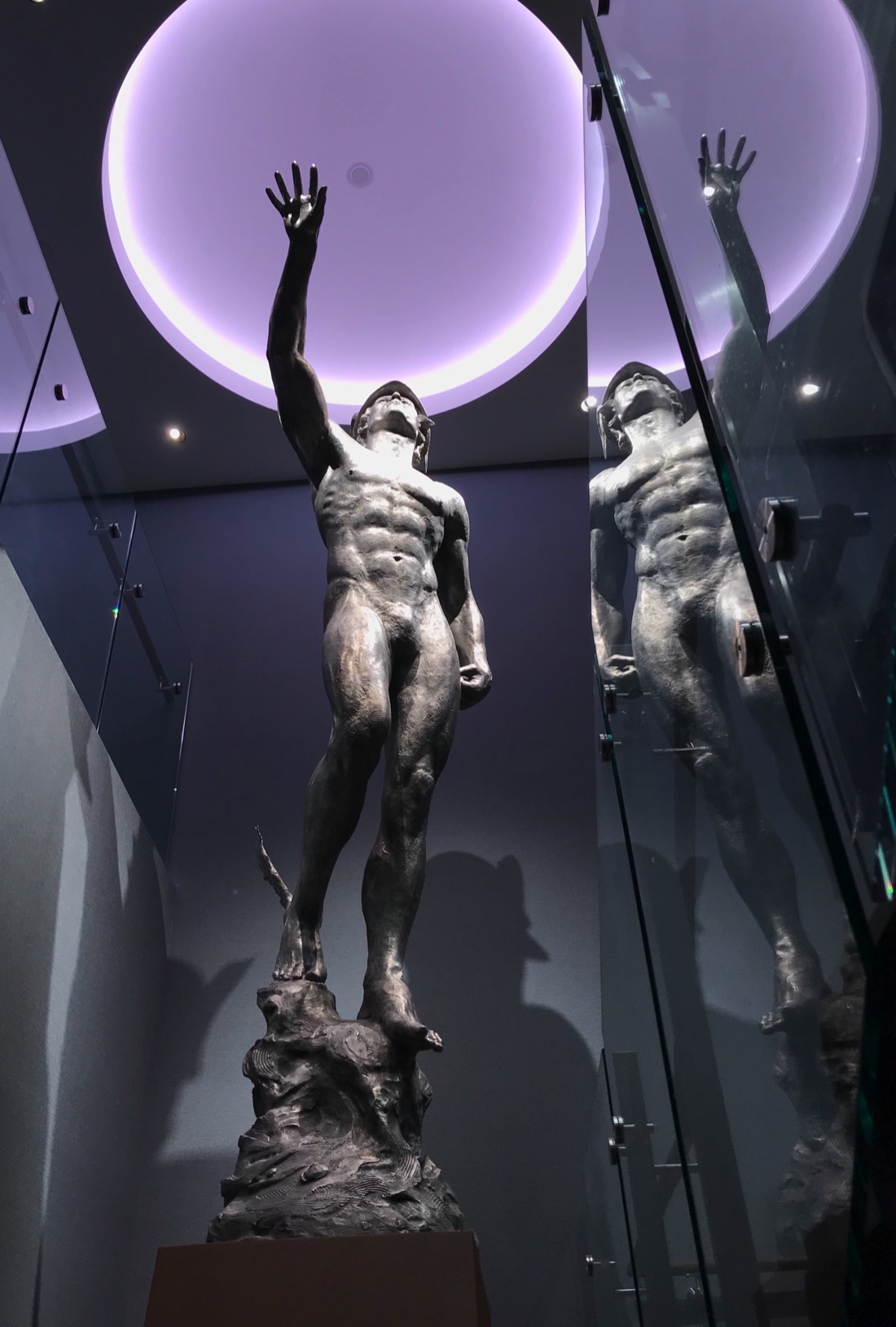 Mercury sculpture rising beneath the illuminated oculus at the Los Angeles Athletic Club