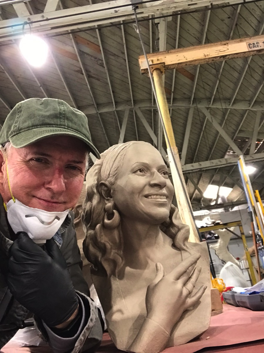 Debbie Allen Raw Bronze with Becker at foundry. Raw sandblasted metel prior to patina. Debbie looking up.