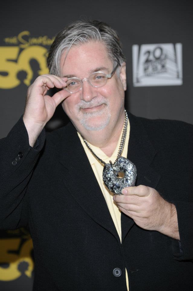 matt groening with cast donut at simpsons party hollywood roosevelt