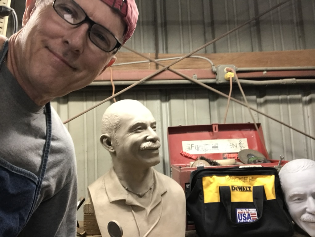 Becker with Morgan Bronze Bust at foundry doing work on metal 