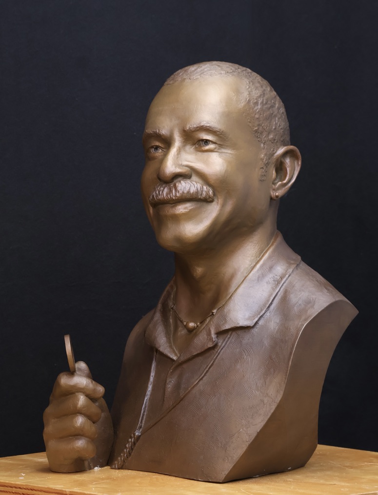 Bronze bust of Donald A. Morgan Cinematographer  bust with his filter he uses to check lighting. 